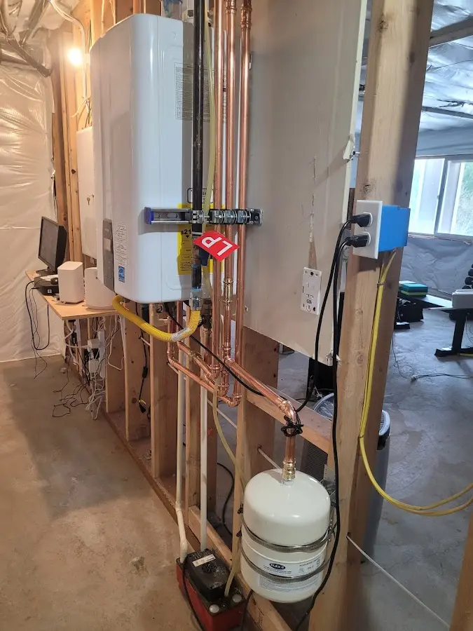 Licensed plumber repairing a kitchen sink in Williston Park