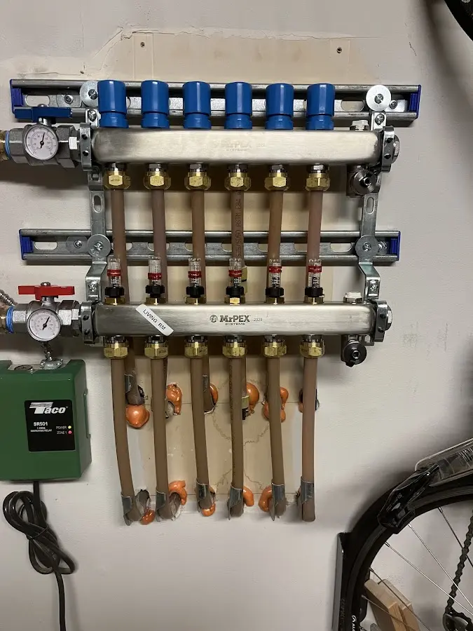 Plumber performing Water Heater Repair at a residential property in Williston Park